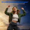 A woman wearing headphones is dancing against a backdrop of a cloudy sky transitioning into a starry night. Produktbild-Vorschau