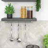 A kitchen shelf with storage jars and utensils. Anteprima dell’immagine prodotto