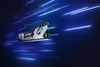 A computer RAM module is shown against a dark blue background with streaks of light. Podgląd zdjęcia produktu