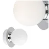 Two close-up views of a modern wall light fixture with a frosted white globe shade and a polished chrome base. Anteprima dell’immagine prodotto