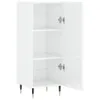A white sideboard with open doors and shelves, standing on black and gold legs. Produktbild-Vorschau
