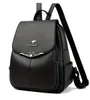 A black leather backpack with a silver kangaroo logo and heart-shaped embellishment. Podgląd zdjęcia produktu