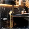 A close-up shot of a gold and black electric hair clipper placed next to a bathroom sink and faucet. Náhled obrázku produktu