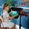 A young girl is drawing on a tablet while sitting at a mobile desk. There is a bowl of strawberries on a side tray. Náhľad obrázku produktu