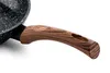 A close-up shot of the handle of a frying pan, showing the wood grain texture. Produktbild-Vorschau