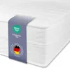 A close-up view of a white mattress with a blue label attached. Produktbild-Vorschau