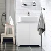 A clean and modern bathroom setting with a white vanity cabinet, a vessel sink, and a grey towel hanging on a hook. Produktbild-Vorschau