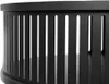 A close-up view of the black metal slatted side of a round table. Produktbild-Vorschau