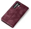 A burgundy flip cover phone case is shown against a white background. Produktbild-Vorschau