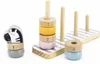 A wooden stacking toy with rings and animal figures, numbered 1-4. Produktbild-Vorschau
