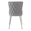 A back view of a gray tufted dining chair with silver metal legs, isolated on a white background. Produktbild-Vorschau
