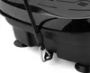 A close-up view of a black vibration plate with a black resistance band attached. Produktbild-Vorschau