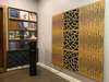 A room with a vinyl record shelf, a speaker, and acoustic wall panels. Anteprima dell’immagine prodotto