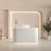 A modern reception desk in a clean, minimalist setting. Produktbild-Vorschau