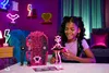 A young girl is playing with a doll and a dollhouse in a room decorated with neon lights. Náhľad obrázku produktu