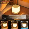 A bedside lamp is shown on a wooden nightstand next to a bed. The image also displays a slider for brightness adjustment and examples of different color temperatures. Produktbild-Vorschau