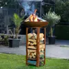 A fire pit with burning wood is shown in a backyard setting with plants and a paved area in the background. Produktbild-Vorschau