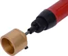 A close-up shot of a tool with a red handle and a gold cylindrical attachment. Voir les images du produit