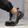 A person wearing black pants and a safety shoe. Produktbild-Vorschau