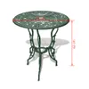 A green bistro table with decorative detailing, shown on a white background with measurement indicators. Voir les images du produit