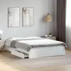 A white bed frame with drawers is shown in a bedroom setting. Podgląd zdjęcia produktu