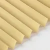 A close-up, angled view of beige pleated blinds against a white background. Produktbild-Vorschau
