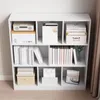 A white bookshelf filled with books and decorative items. Podgląd zdjęcia produktu