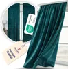 A close-up of a teal velvet curtain with tags attached, and a smaller inset image showing the curtain in a room setting. Produktbild-Vorschau