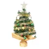 A small, decorated artificial Christmas tree on a white background. Náhľad obrázku produktu