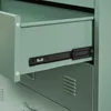 Close-up of an open drawer in a green metal cabinet, showing a drawer slide. Náhled obrázku produktu