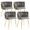Four gray velvet dining chairs with gold metal frames are arranged in a two-by-two grid against a white background. Anteprima dell’immagine prodotto