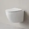 A white wall-mounted toilet with a closed lid against a light gray wall. Produktbild-Vorschau