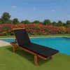 A black cushion on a wooden lounge chair next to a swimming pool, with a colorful flower hedge in the background. Anteprima dell’immagine prodotto