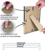 A person's hands are shown demonstrating how to attach a hanging mechanism to a picture frame and how to attach the stand to the back of the frame. There is also a diagram showing measurements. Produktbild-Vorschau