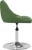A side view of a green velvet chair with a silver base and adjustable height. Produktbild-Vorschau