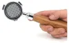 A hand holding a coffee portafilter with a wooden handle. Náhľad obrázku produktu