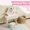 A child's pink vanity table with a stool and a basket of books in a room. Produktbild-Vorschau