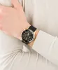 A person's wrist wearing a gold and black Maserati watch. Produktbild-Vorschau