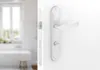 A close-up of a white door handle and lock mechanism, with a blurred bathroom scene in the background. Produktbild-Vorschau