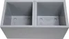 A gray, double-compartment planter box with drainage holes. Produktbild-Vorschau