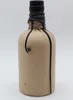 A bottle wrapped in brown paper and tied with black string. Produktbild-Vorschau