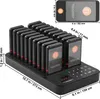 A black charging base with multiple pagers, with dimensions indicated by measurement lines and text. Anteprima dell’immagine prodotto
