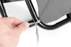 A hand is tying a ribbon to a gray fabric cushion on a black metal frame. Náhľad obrázku produktu