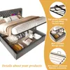 A bed with its storage compartment open, showing items stored inside. Informational callouts highlight features. Náhled obrázku produktu