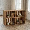 Two wooden crates used as shelving units, displaying decorative items. Produktbild-Vorschau