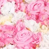 A close-up view of artificial flowers, primarily roses, in various shades of pink, white, and light yellow. Podgląd zdjęcia produktu
