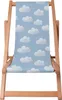 A wooden deck chair with a blue fabric seat featuring a pattern of white clouds. Produktbild-Vorschau