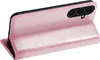 A pink flip case for a smartphone is shown from the back, with the phone inserted and the front cover folded open. Produktbild-Vorschau