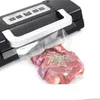 A vacuum sealer with a piece of meat inside a vacuum bag. Podgląd zdjęcia produktu