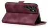 A burgundy flip case for a smartphone is shown from a side-angle, with the front cover folded open. Produktbild-Vorschau
